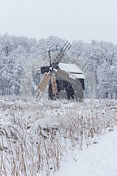 Windmill in Village Museum during snowy winter