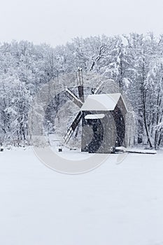 Windmill in Village Museum during snowy winter