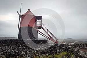 Windmill vineyards with lava wall on the island of Pico entered in the UNESCO World Heritage Site photo