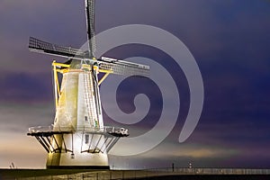 The windmill of Vlissingen by night, typical dutch scenery, historic buildings, Zeeland, the Netherlands photo