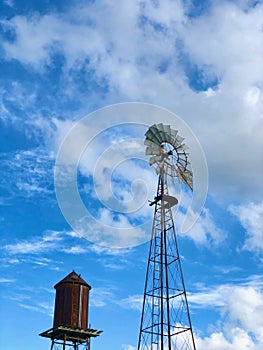 Windmill and water tower On a Sunny Day