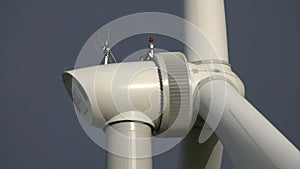 Windmill or wind turbine closeup in rotation photo