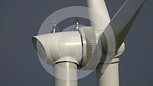 Windmill or wind turbine closeup in rotation photo