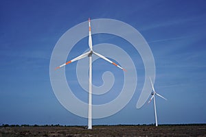 windmills against blue sky