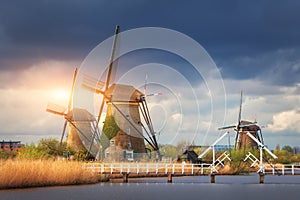 Windmills against cloudy sky at sunset in Kinderdijk, Netherland