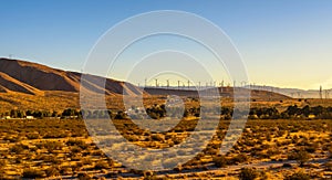 Windmills along a highway in Mojave desert, California