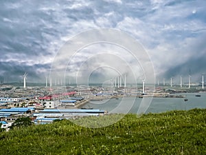 Windmills on background of mysterious sky