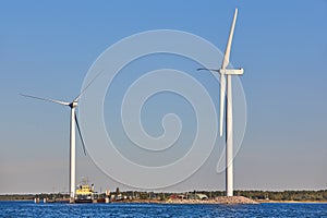 Windmills in the baltic sea. Renewable clean and green energy.