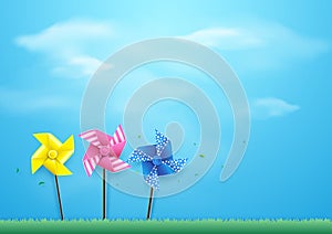 Windmills blowing in the wind on blue sky. Paper art style