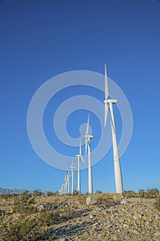 Windmills on a California desert in a low angle view