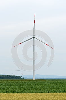Windmills for electric power production. High angle shot of wind turbines on an open landscape in the serbian countryside during t