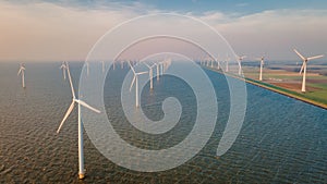 Windmills for electric power production Netherlands Flevoland, Wind turbines farm in sea, windmill farm producing green