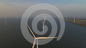 Windmills for electric power production Netherlands Flevoland, Wind turbines farm in sea, windmill farm producing green