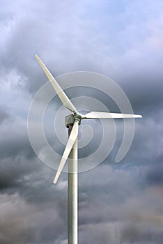 Windmills for electricity generation. Wind turbine against the background of a dark gloomy sky, windy weather in Norway