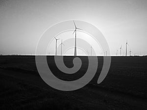 Windmills for energy production on a field in Germany shot in bl