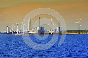 Windmills and factory in the sunset