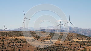 Windmills farm for clean energy production in the mountains