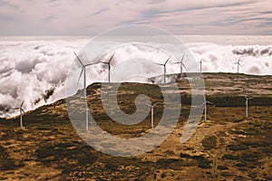 Windmills farm - wind generator turbines - on the top of a mountain