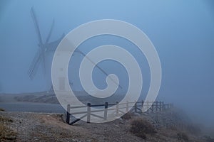 Windmills in the fog in Consuegra town in Spain