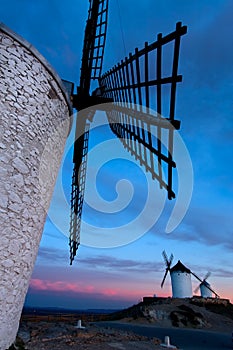 Windmills getting dark in Consuegra city
