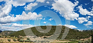 Windmills on the green hills of central Greece