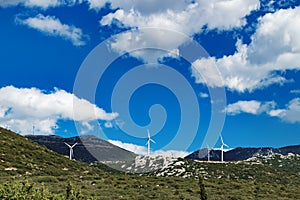 Windmills on the green hills of central Greece