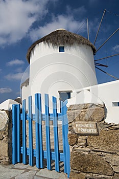 Windmills on the island of Mykonos, Greece. Wide shot with front gate