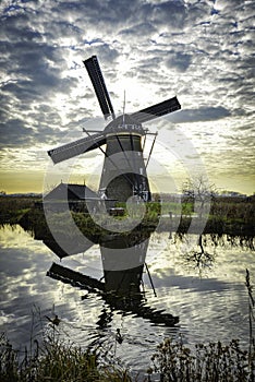 windmills in Kinderdijk Holland with reflection in the river