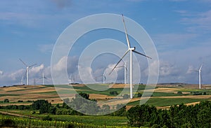 windmills in a large field of sunflowers