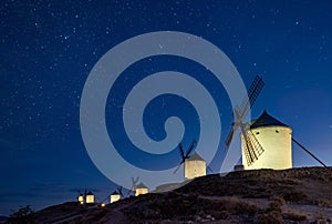 Windmills at the night in Consuegra town in Spain