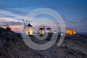 Windmills at the night in Consuegra town in Spain