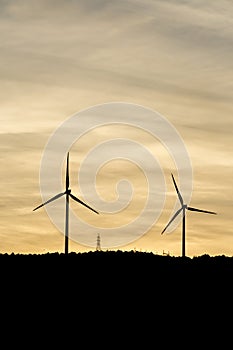 Windmills are producing electric for our world.