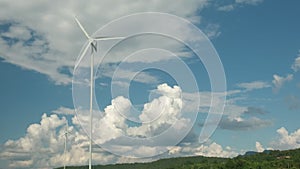The windmills in the sky background generate clean energy.