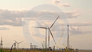 windmills are a source of energy. alternative electricity production. sunset sky