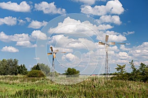 Windmills in summer landscape