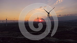 Windmills at sunset, aerial photo wind energy