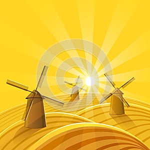 Windmills at sunset background.
