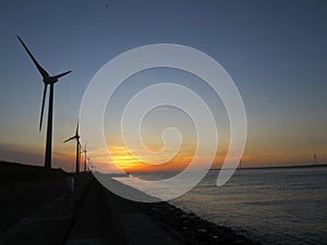 Windmills and sunset on the beach in Lugang Taiwan