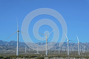 Windmills with three sharp blades that generates renewable green energy