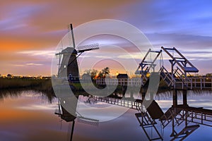Windmills at twilight after sunset in the famous kinderdijk, Netherlands