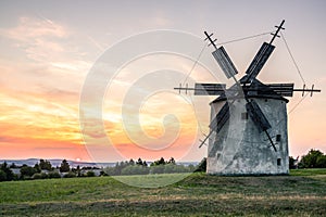 The windmills of TÃ©s, main attraction of TÃ©s, at Lake Balaton in the sunset
