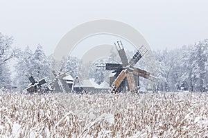 Windmills in Village Museum during snowy winter