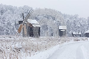 Windmills in Village Museum during snowy winter