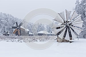 Windmills in Village Museum during snowy winter