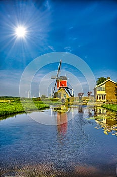 Windmills and water canal in Kinderdijk, Holland or Netherlands