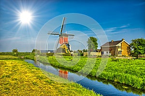 Windmills and water canal in Kinderdijk, Holland or Netherlands