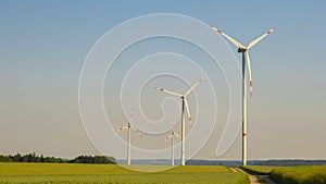 windmills.Wind energy.Wind generators in a wheat field.Electricity and green energy.Green Energy Source