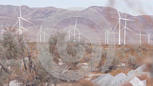 Windmills on wind farm, wind mill energy generators. Desert windfarm, USA.