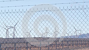 Windmills on wind farm, wind mill energy generators. Desert windfarm, USA.