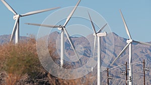 Windmills on wind farm, wind mill energy generators. Desert windfarm, USA.